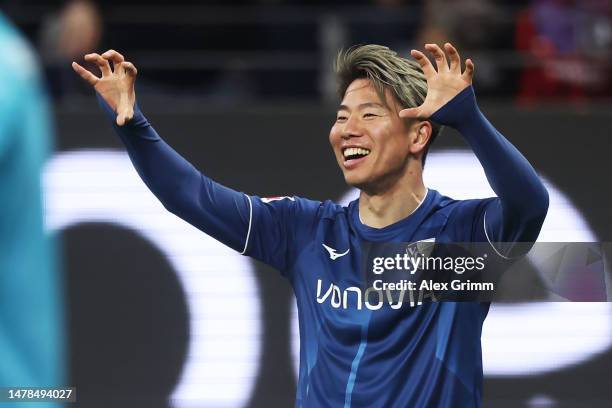 Takuma Asano of VfL Bochum 1848 celebrates after scoring the team's first goal during the Bundesliga match between Eintracht Frankfurt and VfL Bochum...