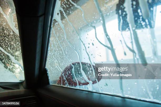 wet windscreen and window of a car in a car wash - drive through car wash stock pictures, royalty-free photos & images
