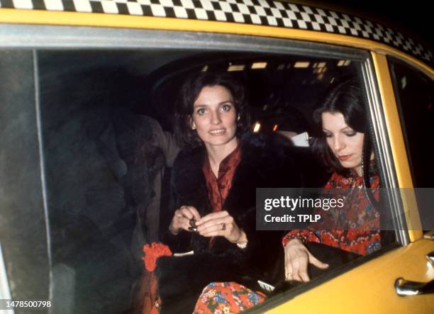 Canadian activist Margaret Trudeau leaves in a taxi with an unidentified friend after watching Mikhail Baryshnikov's opening night benefit...