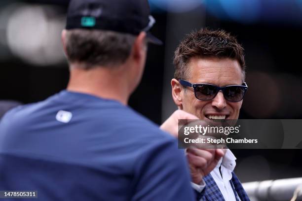 General Manager Jerry Dipoto speaks with manager Scott Servais of the Seattle Mariners during Opening Day at T-Mobile Park on March 30, 2023 in...