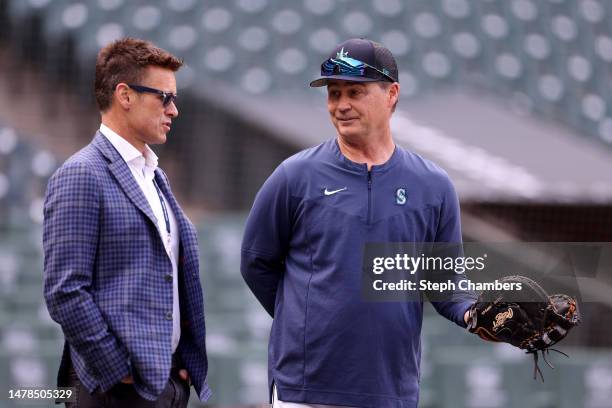 General Manager Jerry Dipoto speaks with manager Scott Servais of the Seattle Mariners during Opening Day at T-Mobile Park on March 30, 2023 in...