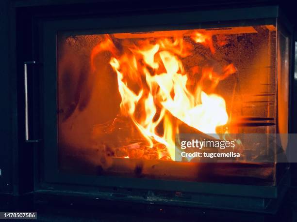 the fireplace in the home - burning woods moments - warming up stock pictures, royalty-free photos & images