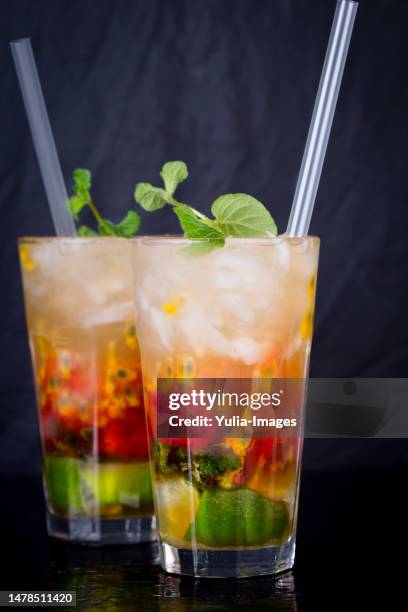 cocktail with fruit and straws - raspberry cocktail stock pictures, royalty-free photos & images