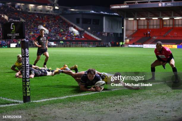 Ioan Lloyd of Bristol Bears is tackled by Bautista Delguy of ASM Clermont Auvergne to deny a try during the EPCR Challenge Cup Round of Sixteen match...