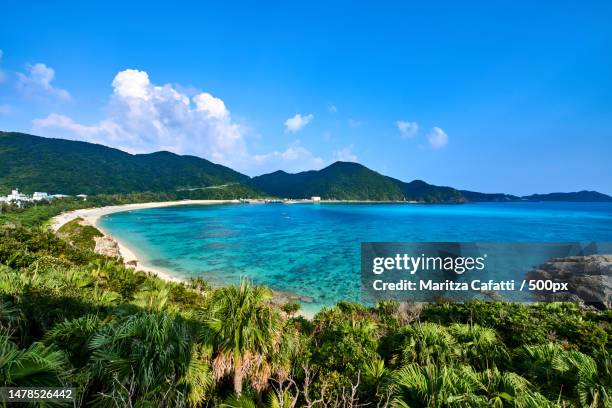 scenic view of sea against blue sky,tokashiki island,japan - okinawa blue sky beach landscape stockfoto's en -beelden