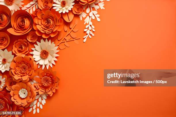 many flowers made of paper on orange background with copy space - mom flirting stockfoto's en -beelden