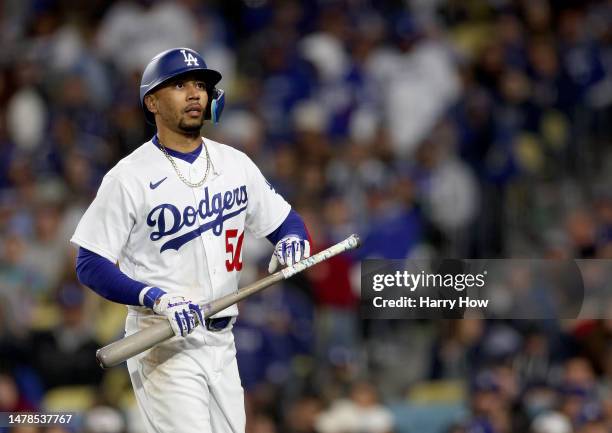 Mookie Betts of the Los Angeles Dodgers reacts to his strikeout during an 8-2 win over the Arizona Diamondbacks on opening day of the 2023 Major...