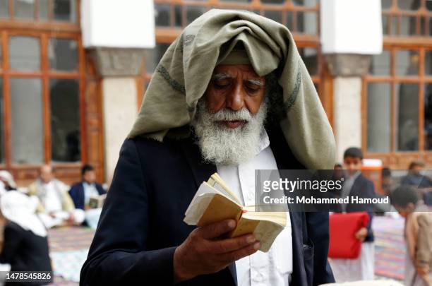 Man reads the holy Quran inside the historical al-Kabir Mosque during the Holy month of Ramadan on March 31, 2023 in Sana'a, Yemen. Ramadan is the...