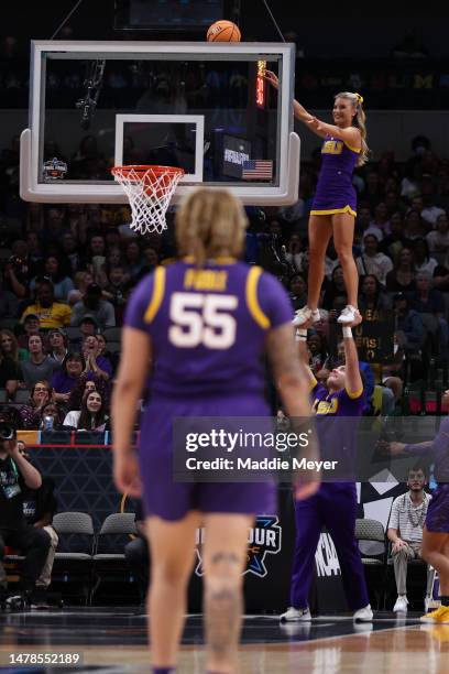 An LSU Lady Tigers cheerleader dislodges a ball during the first half of the game against the Virginia Tech Hokies during the 2023 NCAA Women's...