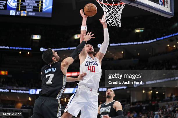 Ivica Zubac of the Los Angeles Clippers goes to the basket against Santi Aldama of the Memphis Grizzlies during the first half at FedExForum on March...