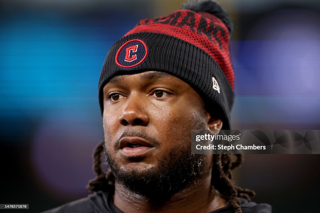 Josh Bell of the Cleveland Guardians looks on before the game against Josh Bell of the Cleveland Guardians looks on before the game against