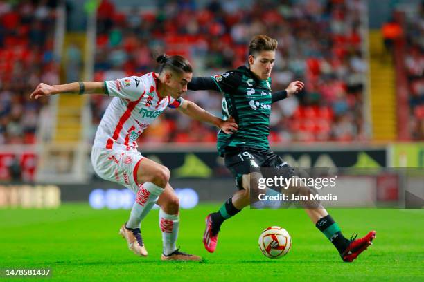 Alexis Pena of Necaxa fights for the ball with Santiago Munoz of Santos during the 13th round match between Necaxa and Santos Laguna as part of the...