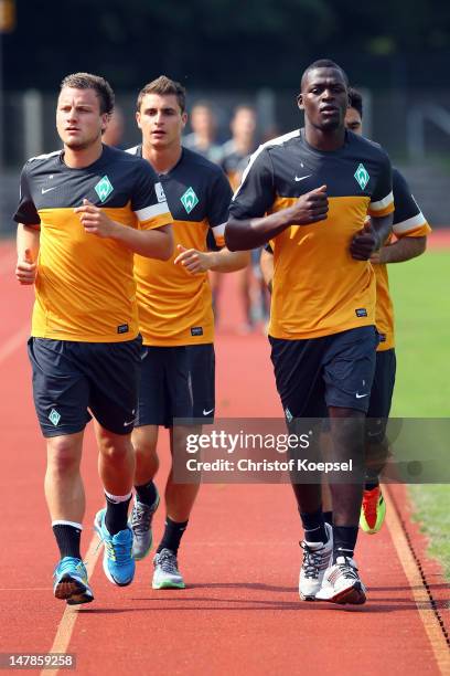 Philipp Bargfrede, Sebastian Mielitz, Assani Lukimya and Mehmet Ekici run during blood testing of Werder Bremen at the training ground at Weser...
