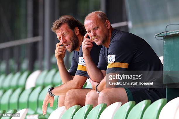 Assistant coach Wolfgang Rolff and head coach Thomas Schaaf of Bremen watch the blood testing at the training ground at Weser Stadium on July 5, 2012...