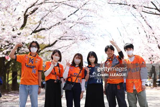 Shimizu S-Pulse supporters pose for photographs under the cherry blossoms prior to the J.LEAGUE Meiji Yasuda J2 7th Sec. Match between Ventforet Kofu...