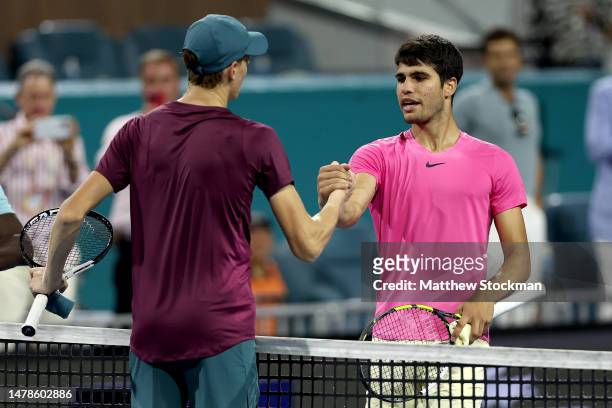 Jannik Sinner of Italy is congratulated by Carlos Alcaraz of Spain after their match during the semifinals of the Miami Open at Hard Rock Stadium on...