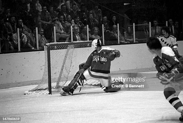 Goalie Ron Low of the Washington Capitals makes the save during an NHL game against the New York Rangers on October 9, 1974 at the Madison Square...