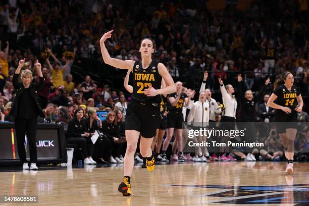 Caitlin Clark of the Iowa Hawkeyes reacts after a three point basket during the fourth quarter against the South Carolina Gamecocks during the 2023...