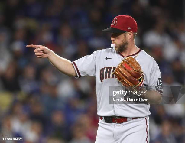 Merrill Kelly of the Arizona Diamondbacks reacts to an out of David Peralta of the Los Angeles Dodgers during the fourth inning at Dodger Stadium on...