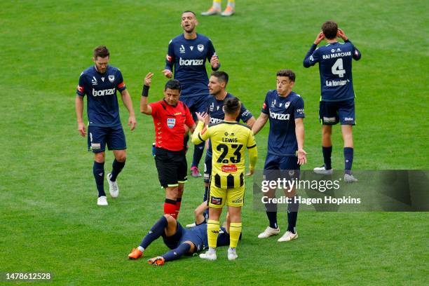 Referee Alireza Faghani signals to medical staff after an injury to Chris Ikonomidis of Melbourne Victory during the round 22 A-League Men's match...