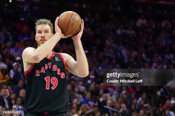 Jakob Poeltl of the Toronto Raptors controls the ball against the Philadelphia 76ers at the Wells Fargo Center on March 31, 2023 in Philadelphia,...