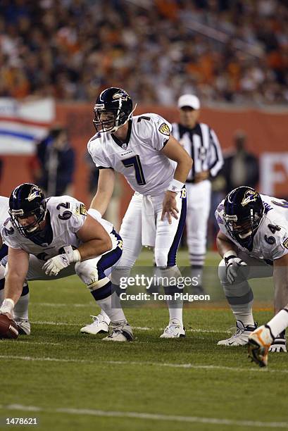Quarterback Chris Redman of the Baltimore Ravens crouches over center Mike Flynn during the NFL game against the Cleveland Browns on October 6, 2002...
