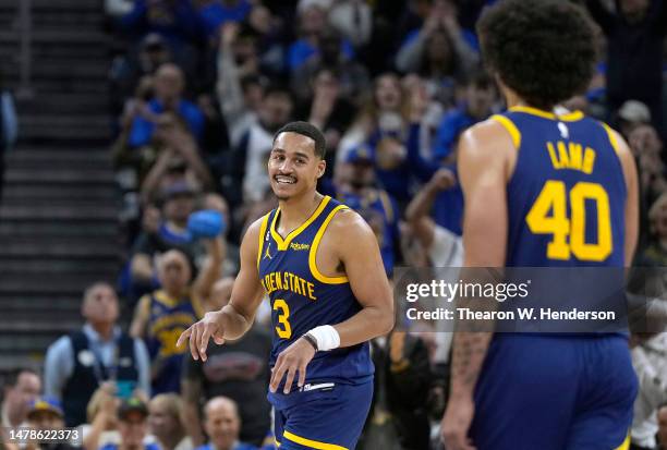 Jordan Poole of the Golden State Warriors reacts after getting fouled while shooting and making a three-point shot against the San Antonio Spurs...