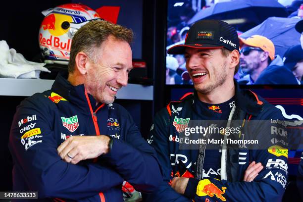 Red Bull Racing Team Principal Christian Horner talks with Max Verstappen of the Netherlands and Oracle Red Bull Racing in the garage during...