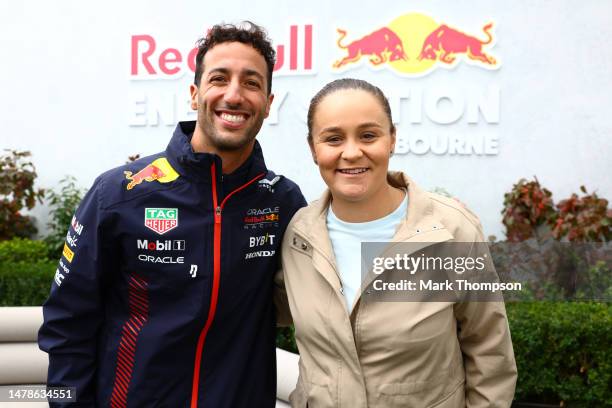 Daniel Ricciardo of Australia and Oracle Red Bull Racing poses for a photo with Ashleigh Barty in the Paddock during qualifying ahead of the F1 Grand...