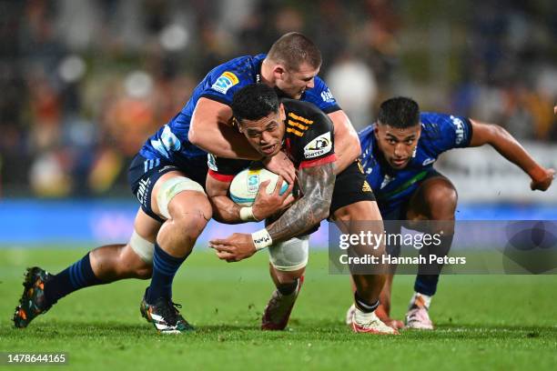 Dalton Papalii of the Blues tackles Etene Nanai-Seturo of the Chiefs during the round six Super Rugby Pacific match between Chiefs and Blues at FMG...