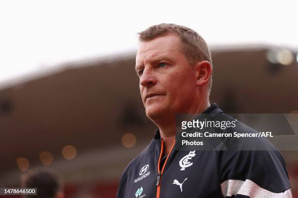 Blues head coach Michael Voss walks across the field during the round three AFL match between Greater Western Sydney Giants and Carlton Blues at...