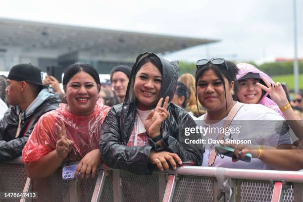 Fans gather in the rain at Room Service with Ice Cube & Cypress Hill at The Trusts Outdoors on stage on April 01, 2023 in Auckland, New Zealand.