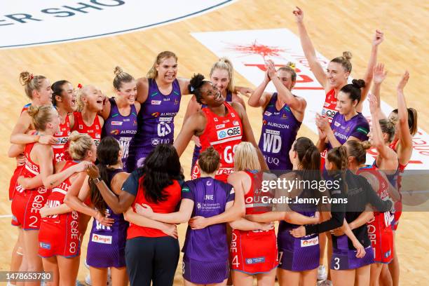 Players from The Swifts and Firebirds form a circle to celebrate 200th game played by Romelda Aiken-George of the Swifts during the round three Super...