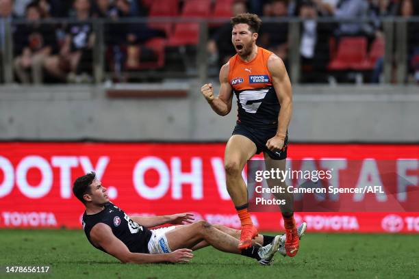 Toby Greene of the Giants celebrates kicking a goal during the round three AFL match between Greater Western Sydney Giants and Carlton Blues at...