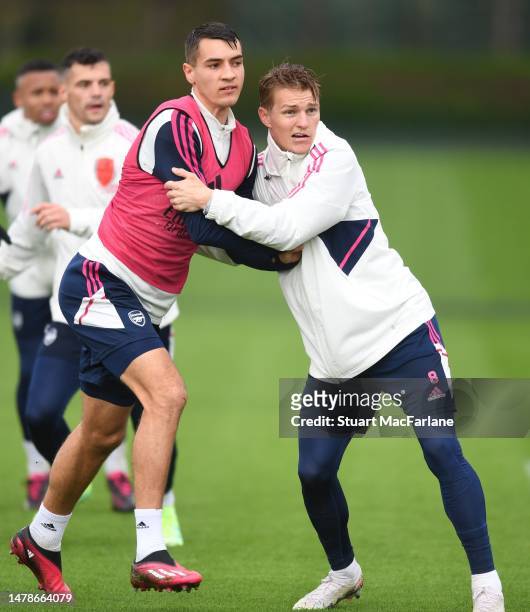 Jakub Kiwior and Martin Odegaard of Arsenal during a training session at London Colney on March 31, 2023 in St Albans, England.