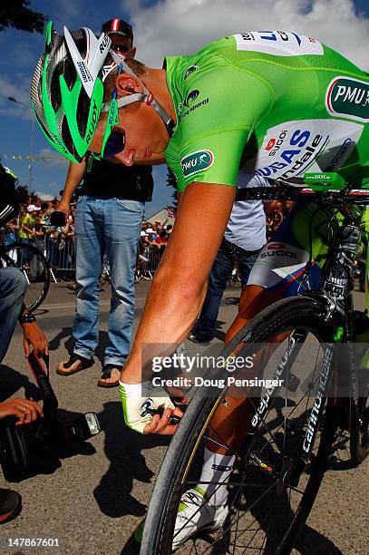 Peter Sagan of Slovakia riding for Liquigas-Cannondale in the points leader's green jersey prepares his bike for the start of stage four of the 2012...