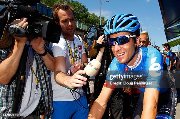 Christian Vande Velde of the USA riding for Garmin-Sharp is surrounded by the media as he prepares for the start of stage five of the 2012 Tour de...