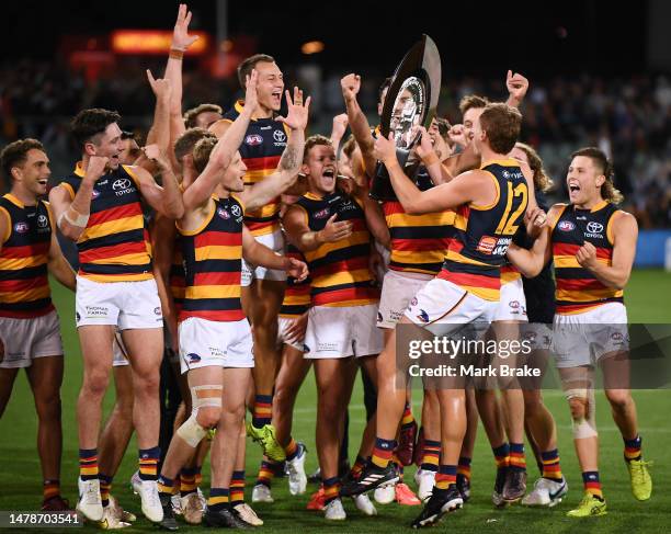 Jordan Dawson of the Crows brings the Variety Showdown Sheild to the team during the round three AFL match between Port Adelaide Power and Adelaide...