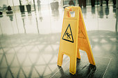 Yellow slippery warning sign