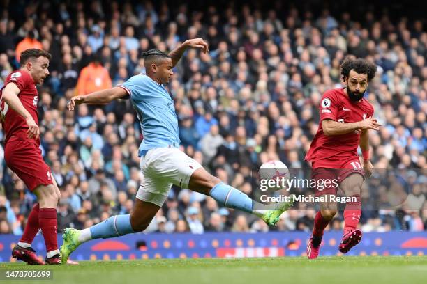 Mohamed Salah of Liverpool scores the team's first goal during the Premier League match between Manchester City and Liverpool FC at Etihad Stadium on...