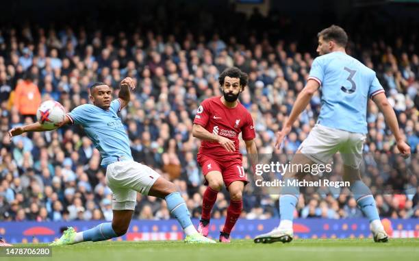 Mohamed Salah of Liverpool scores the team's first goal during the Premier League match between Manchester City and Liverpool FC at Etihad Stadium on...