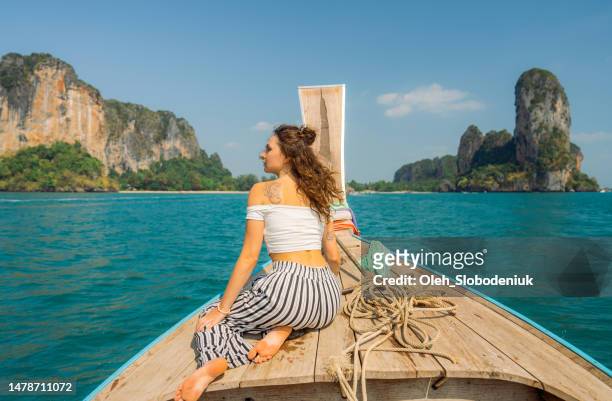 woman traveling with thai taxi boat - james bond island stock pictures, royalty-free photos & images