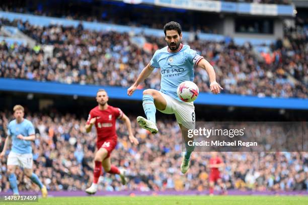 Ilkay Guendogan of Manchester City controls the ball during the Premier League match between Manchester City and Liverpool FC at Etihad Stadium on...