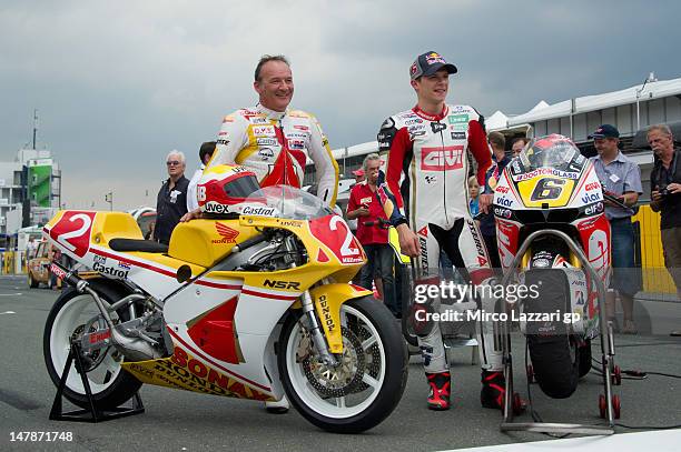 Stefan Bradl of Germany and LCR Honda MotoGP and his father Helmut Bradl of Germany pose with their the bikes on grid during the pre-event "MotoGP...