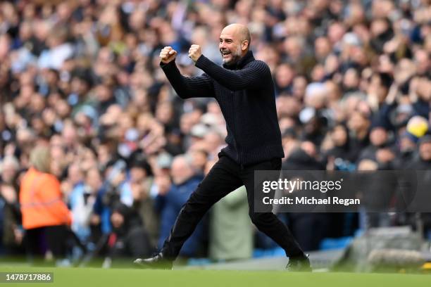 Pep Guardiola, Manager of Manchester City, celebrates after their sides third goal during the Premier League match between Manchester City and...