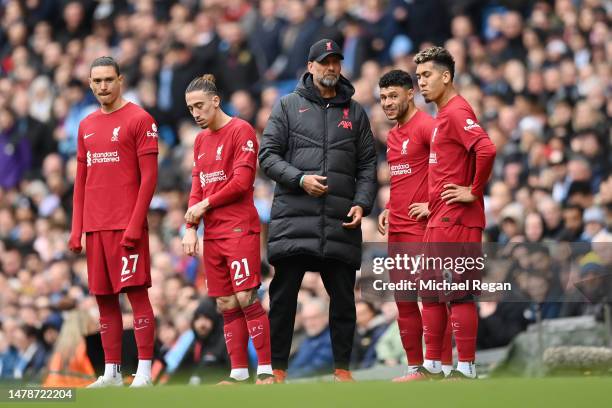 Juergen Klopp, Manager of Liverpool, speaks to incoming substitutes during the Premier League match between Manchester City and Liverpool FC at...