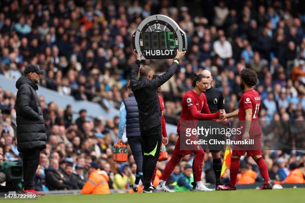 Darwin Nunez replaces Mohamed Salah of Liverpool during the Premier League match between Manchester City and Liverpool FC at Etihad Stadium on April...