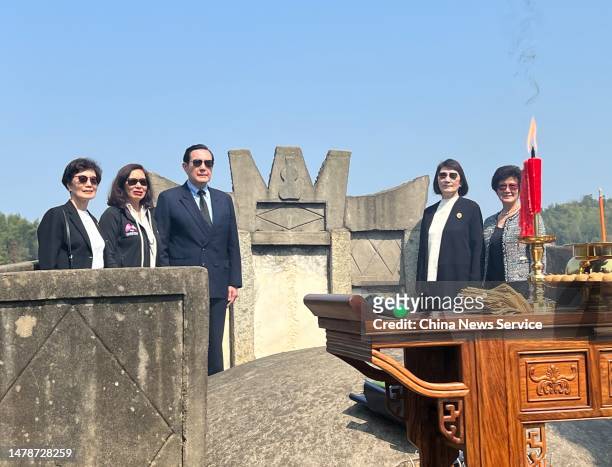 Ma Ying-jeou, former chairman of the Chinese Kuomintang party, and his sisters pose at the tomb of his grandfather on April 1, 2023 in Xiangtan...