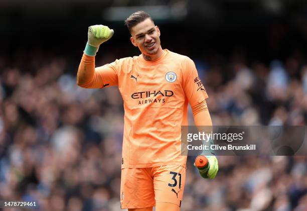 Ederson of Manchester City celebrates after the team's victory during the Premier League match between Manchester City and Liverpool FC at Etihad...