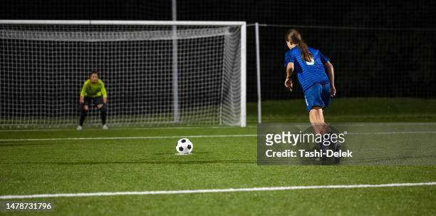 female soccer players - penalty shot - penalty kick stock pictures, royalty-free photos & images